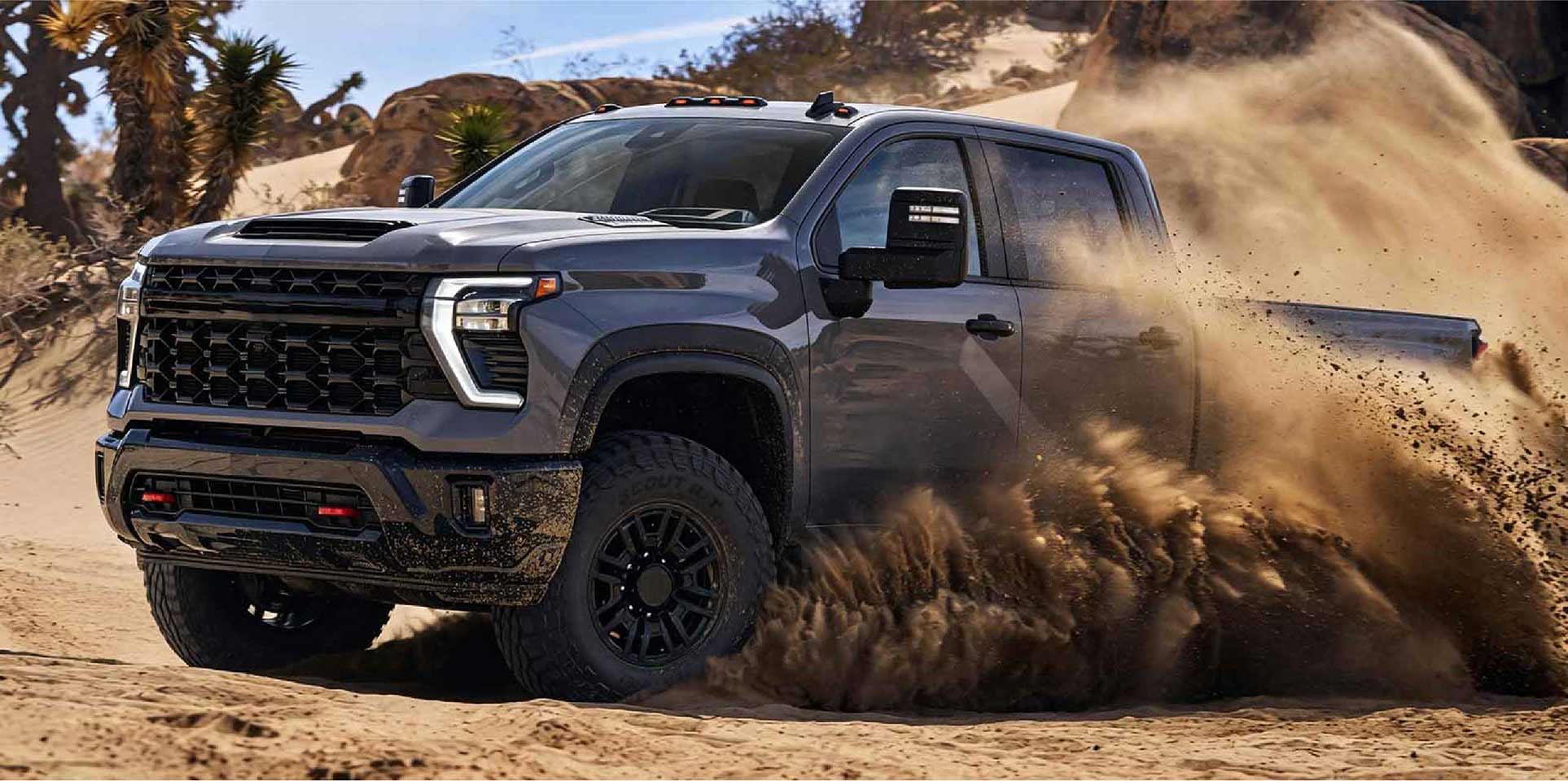 SUV driving through desert terrain